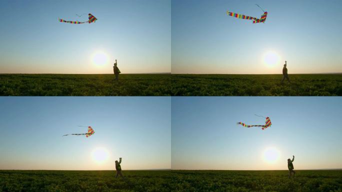 日落时，一个男孩正在天上玩风筝。4K