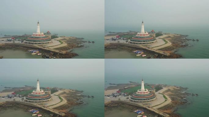 白天烟雾青岛市灯塔水族馆湾空中全景4k中国