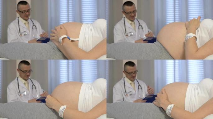 男医生检查一名孕妇