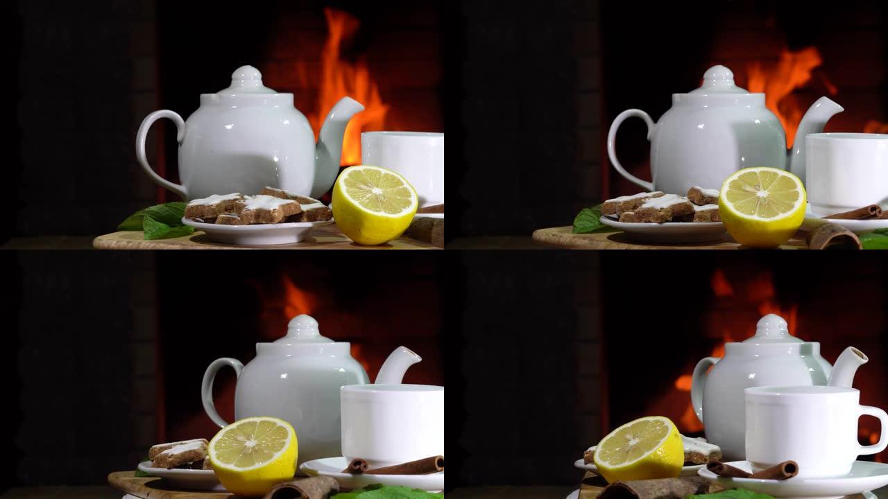 乡间别墅燃烧的壁炉前有柠檬和薄荷茶。