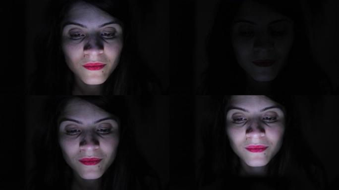 女人脸看着蓝光屏幕的人晚上在黑暗中使用手机