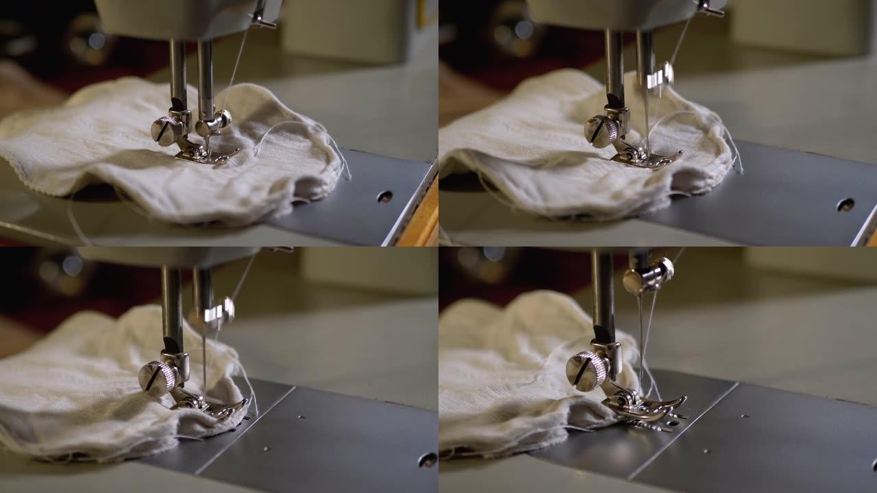 慢动作的缝纫机针。裁缝缝制自制面料面膜