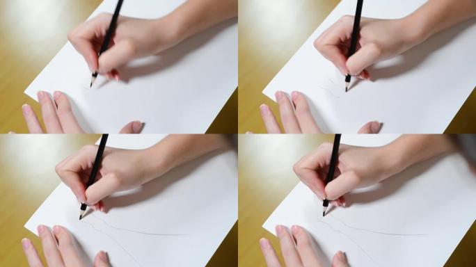 设计师用铅笔在纸上勾勒出一个新想法