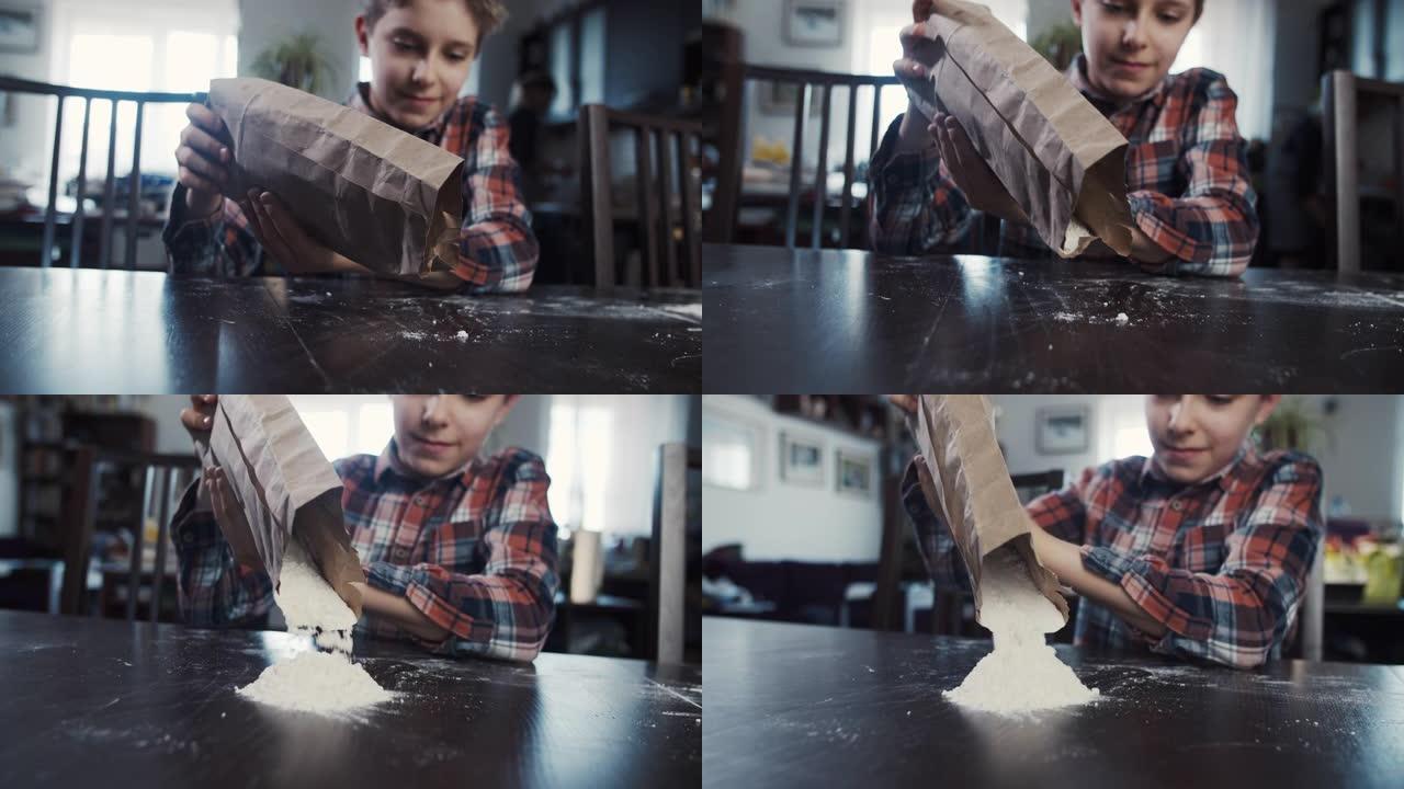 小男孩正在桌子上倒面粉