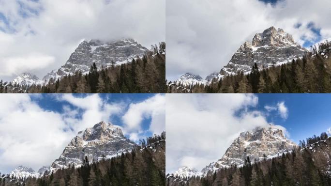 冬季，在Eutopean阿尔卑斯山的白雪皑皑的落基山上移动云层的时间流逝