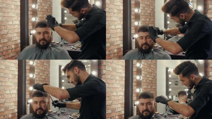 年轻的理发师在理发店为大胡子的男性客户剪头发