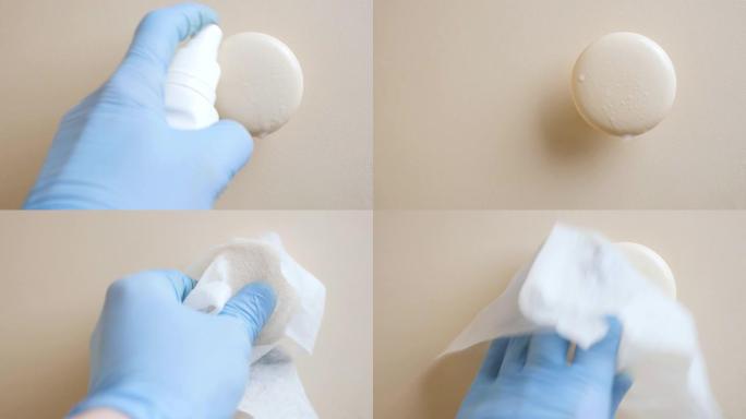 使用抗菌湿纸巾消毒房间门把手的医疗手套的近距离观察。清洁和消毒门把手。细菌、细菌、Covid-19、