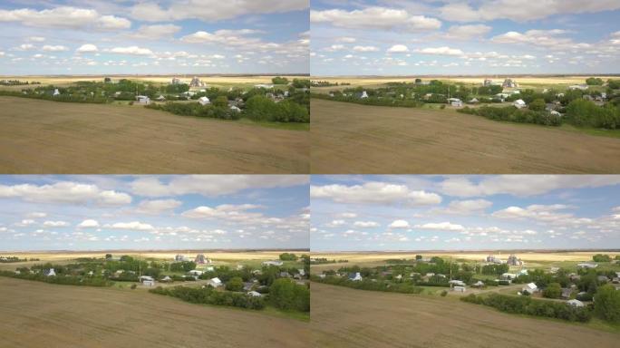 加拿大小镇，位于荒无人烟的草原和田野中，萨斯喀彻温省马尼托巴省榛树农业4k飞行无人机