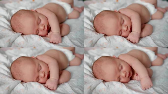 可爱的2周大的新生婴儿正在床上睡觉。特写镜头。