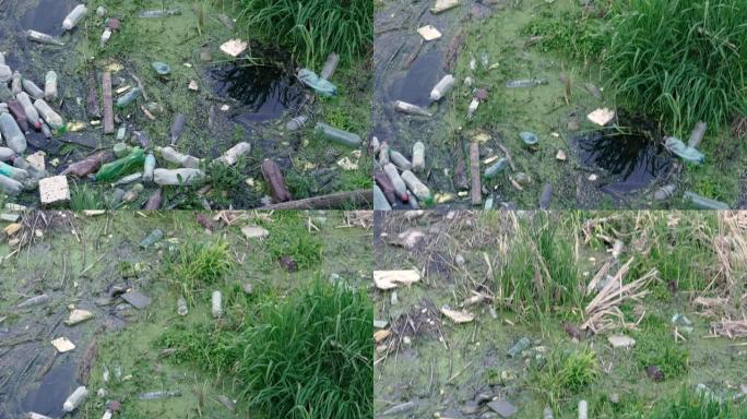 水污染。塑料垃圾漂浮在河里。