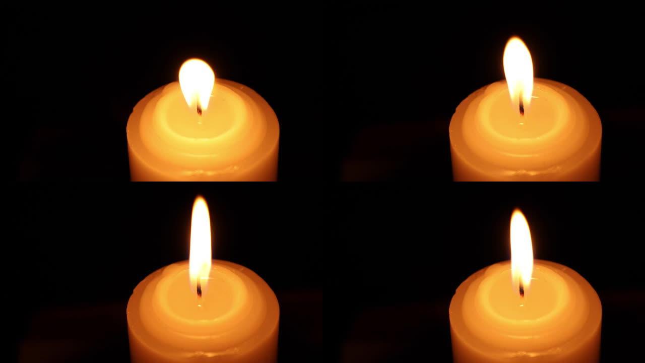 黑暗中的蜡烛与耀斑火焰