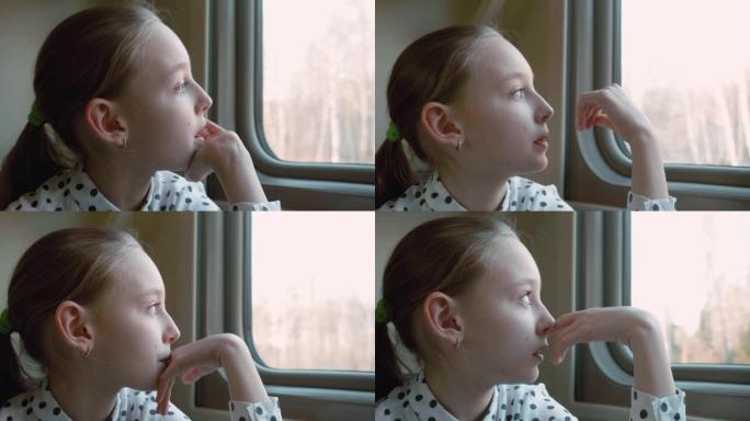 沉思的女孩少年在旅行时看着火车窗户。肖像乘客女孩少年在火车旅行时若有所思地看着窗户。