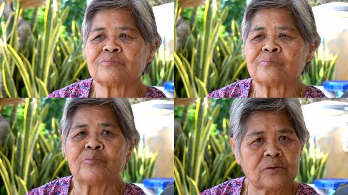 亚洲老妇人采访镜头认真交流沟通滔滔不绝