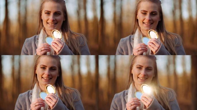 女人用小镜子反射光线