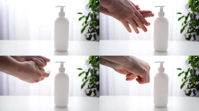 人的手在瓶子中使用凝胶，消毒剂，防腐剂