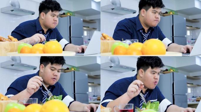 超重的商人喜欢他的健康，吃沙拉和橙汁。