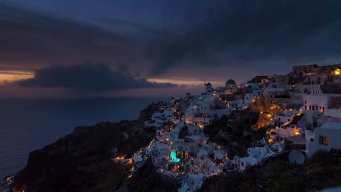 日落天空著名的圣托里尼岛伊亚镇山全景4k延时希腊