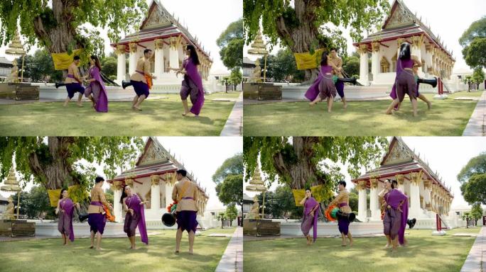 Yonung亚洲泰国传统木鼓舞表演。4k慢动作。