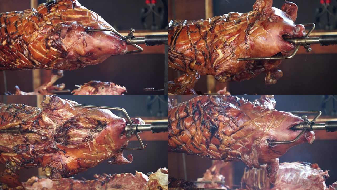 整头猪的头部被烤在原木的明火上
