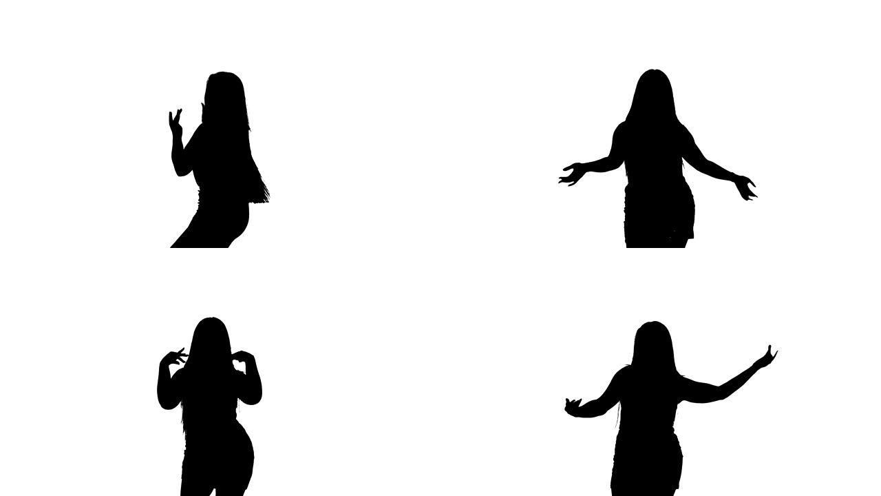 一个年轻女孩跳东方肚皮舞的剪影，中长镜头