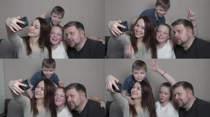 有孩子的幸福大家庭在家用智能手机拍照。全球新型冠状病毒肺炎流行。