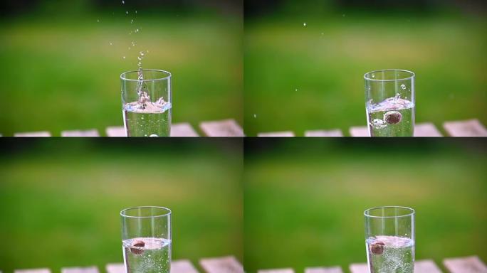 榛子掉入一杯水中慢动作