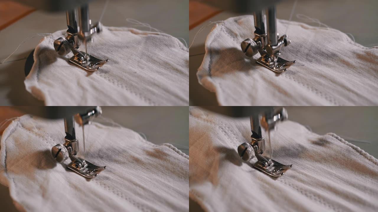 慢动作的缝纫机针。裁缝缝制自制面料面膜