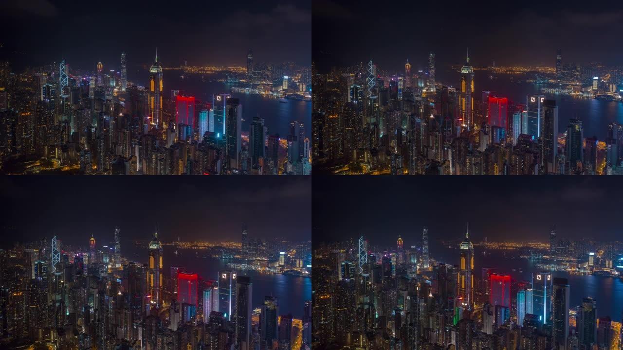夜间照明飞行在香港市区海湾空中全景4k延时