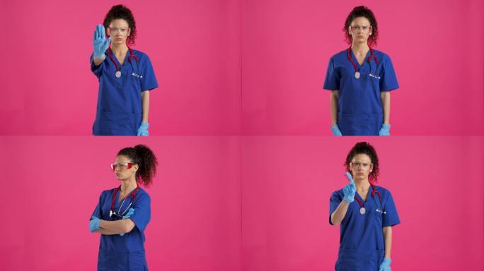 年轻的女医生在粉红色背景上显示停止和没有标志