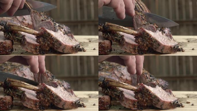 刚从木炭烤架上烤的羊肉架子被切成薄片