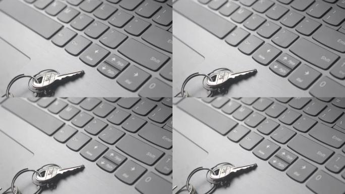 笔记本电脑键盘上钥匙圈静物的特写。概念图像显示为网络安全密钥。网络安全、保护和隐私概念。