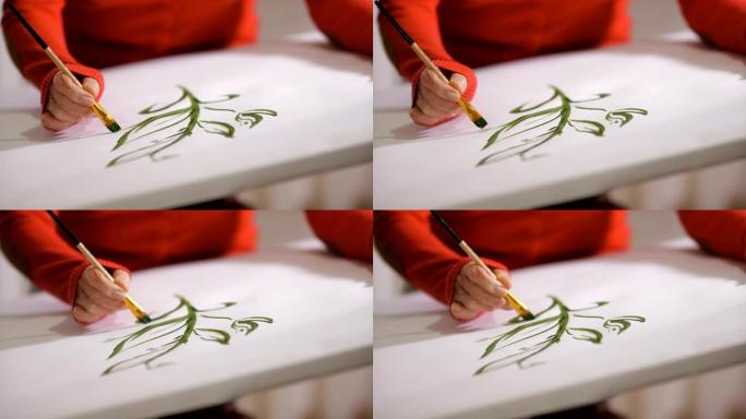 火灾幸存者的艺术疗法。用烧伤疤痕的女人的手在画布上画绿色水彩早午餐。打破女性美体标准。包容性概念