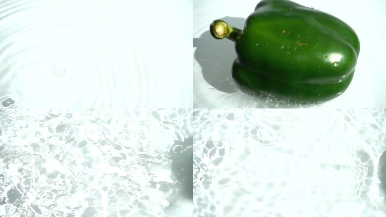 甜青椒掉进水里。慢动作。