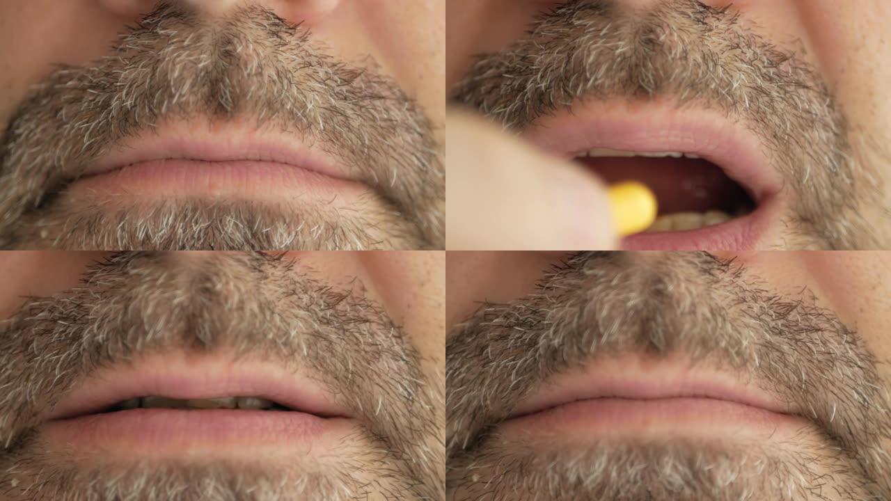 一个留着灰色胡须的男人从病毒吞下药丸，冠状病毒，covid19，并做出一张脸。超宏观特写。