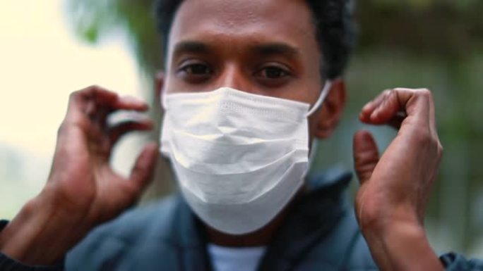 戴着新型冠状病毒肺炎大流行面具的非洲黑人男子的肖像