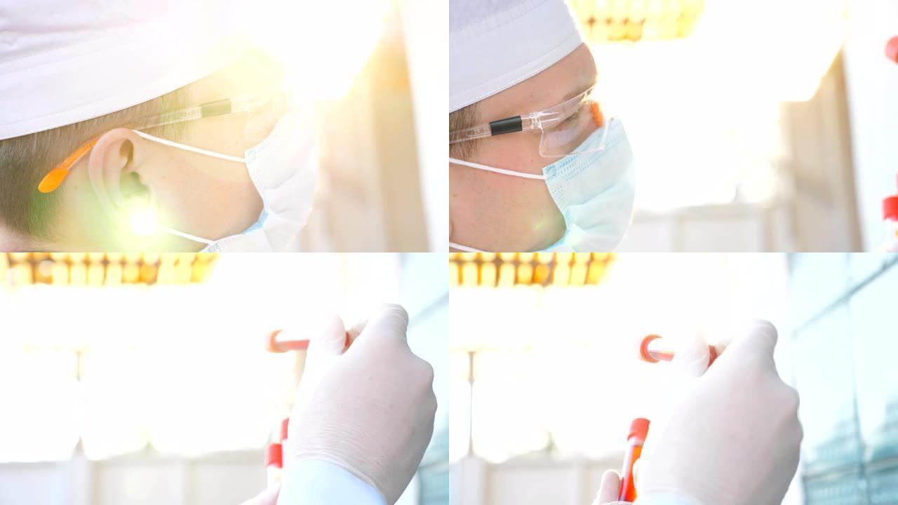 医生的简介看试管与血液样本冠状病毒。男性医生戴着防护眼镜，测试血液样本以新型冠状病毒肺炎病毒。大流行