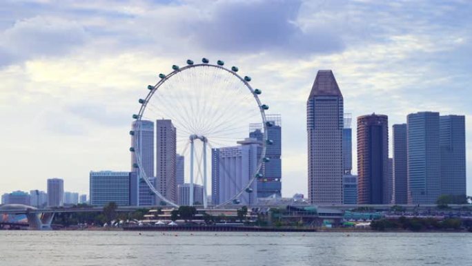 延时视频4K，新加坡摩天轮和商业金融区的美丽时刻，新加坡2020年2月2日市中心的现代建筑。