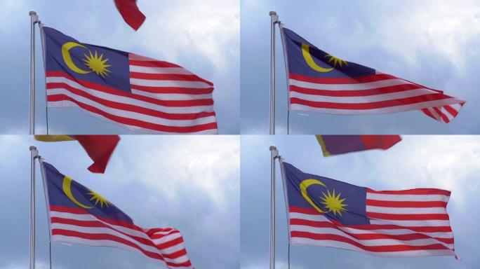 慢动作的马来西亚国旗在阳光明媚的日子在风中飘扬