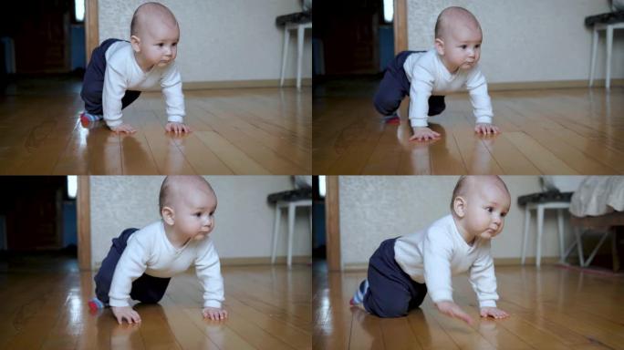 有趣开朗的高加索婴儿学会在家里的地板上四肢爬行