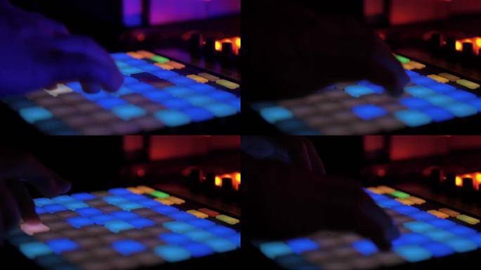 DJ声音控制台。音乐设备。玩合成器。特写。音乐会。夜总会派对。音响工程师调整声音。活。混搭。音乐表演