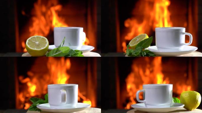 带柠檬和薄荷的白色杯子中的茶在乡间别墅燃烧的壁炉前旋转。