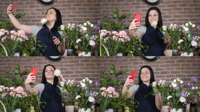 花店的专业花店在手机摄像头上与白玫瑰自拍