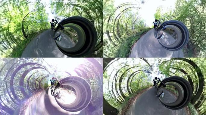 男子骑电动自行车穿越春天森林，360度视频