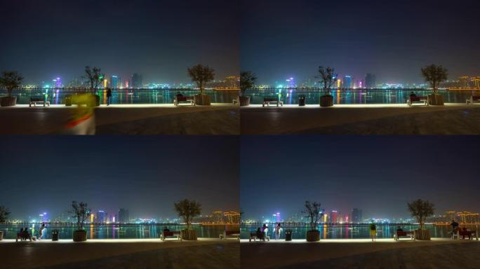 夜间照明杭州市中心河边步行湾延时全景4k中国