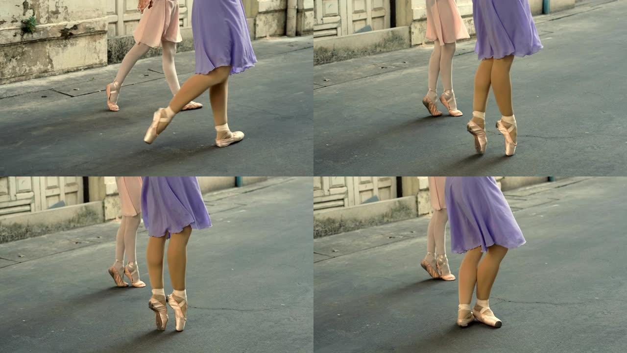 鞋子芭蕾舞女演员在街上跳舞的特写镜头