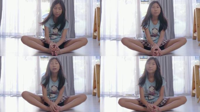 亚洲女孩在家做瑜伽，生活方式理念。