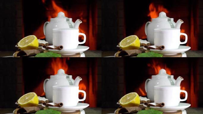 乡间别墅燃烧的壁炉前有柠檬和薄荷茶。