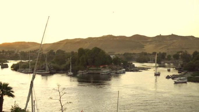 日落时分，阿斯旺尼罗河河岸的长镜头美丽的历史风景