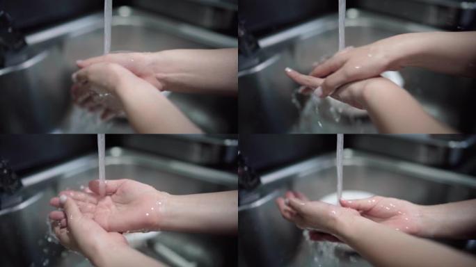 女人在家厨房洗手预防消杀清洗