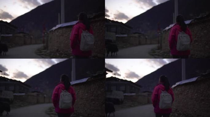 观观光徒步西藏村庄游玩穿冲锋衣的女生背影